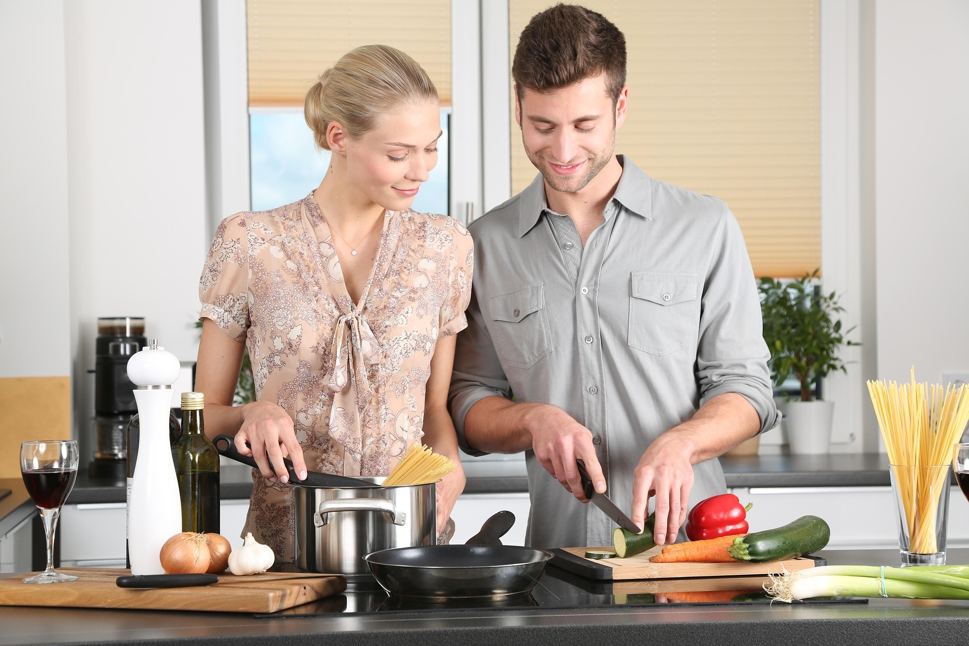 Couple preparing to cook in the kitchen